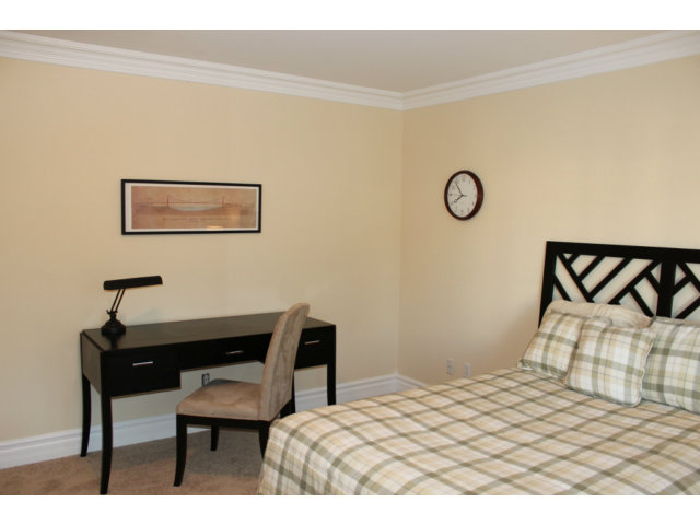 76 Images Circle Milpitas, CA 95035 - Photo 14 of 18 a bedroom with a bed and a table in it