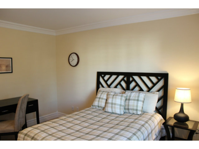 76 Images Circle Milpitas, CA 95035 - Photo 15 of 18 a bedroom with a bed and a lamp on table