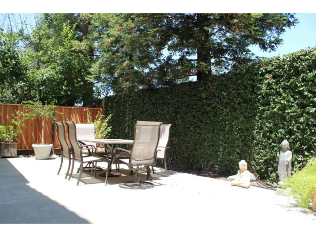 76 Images Circle Milpitas, CA 95035 - Photo 17 of 18 a view of a patio with table and chairs with wooden floor and fence