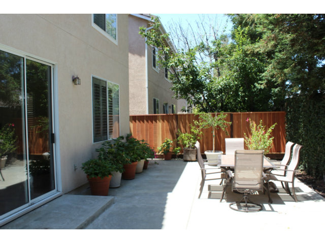 76 Images Circle Milpitas, CA 95035 - Photo 18 of 18 a view of a patio with table and chairs potted plants with wooden floor