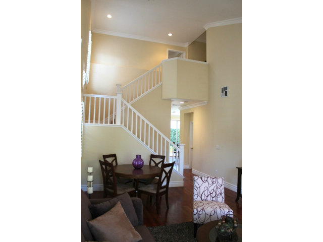 76 Images Circle Milpitas, CA 95035 - Photo 3 of 18 a view of a hallway with dining room and furniture