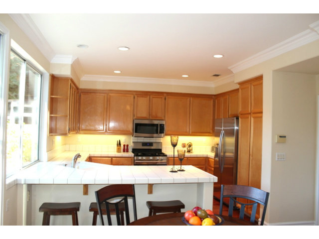 76 Images Circle Milpitas, CA 95035 - Photo 9 of 18 a kitchen with stainless steel appliances a stove a refrigerator and a cabinets