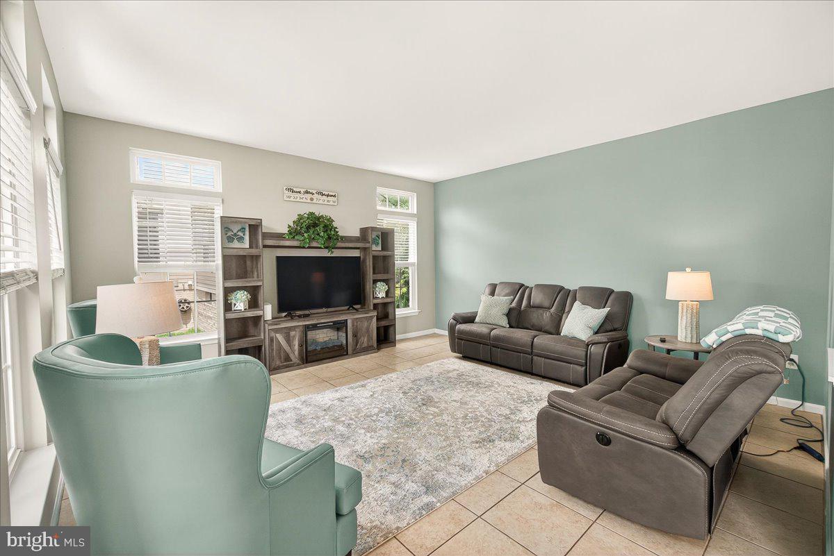 1308 Crossbow Road Mount Airy, MD 21771 - Photo 22 of 55 a living room with furniture and a flat screen tv