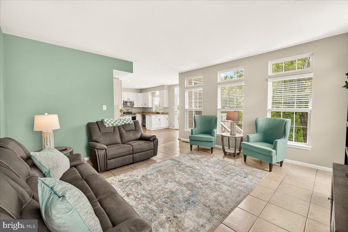 1308 Crossbow Road Mount Airy, MD 21771 - Photo 23 of 55 a living room with furniture and a large window