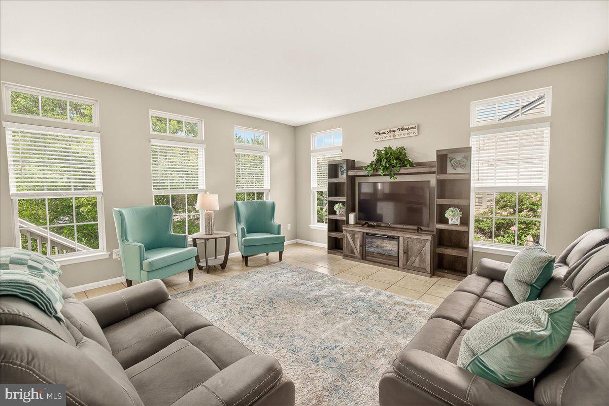 1308 Crossbow Road Mount Airy, MD 21771 - Photo 24 of 55 a living room with furniture and a flat screen tv
