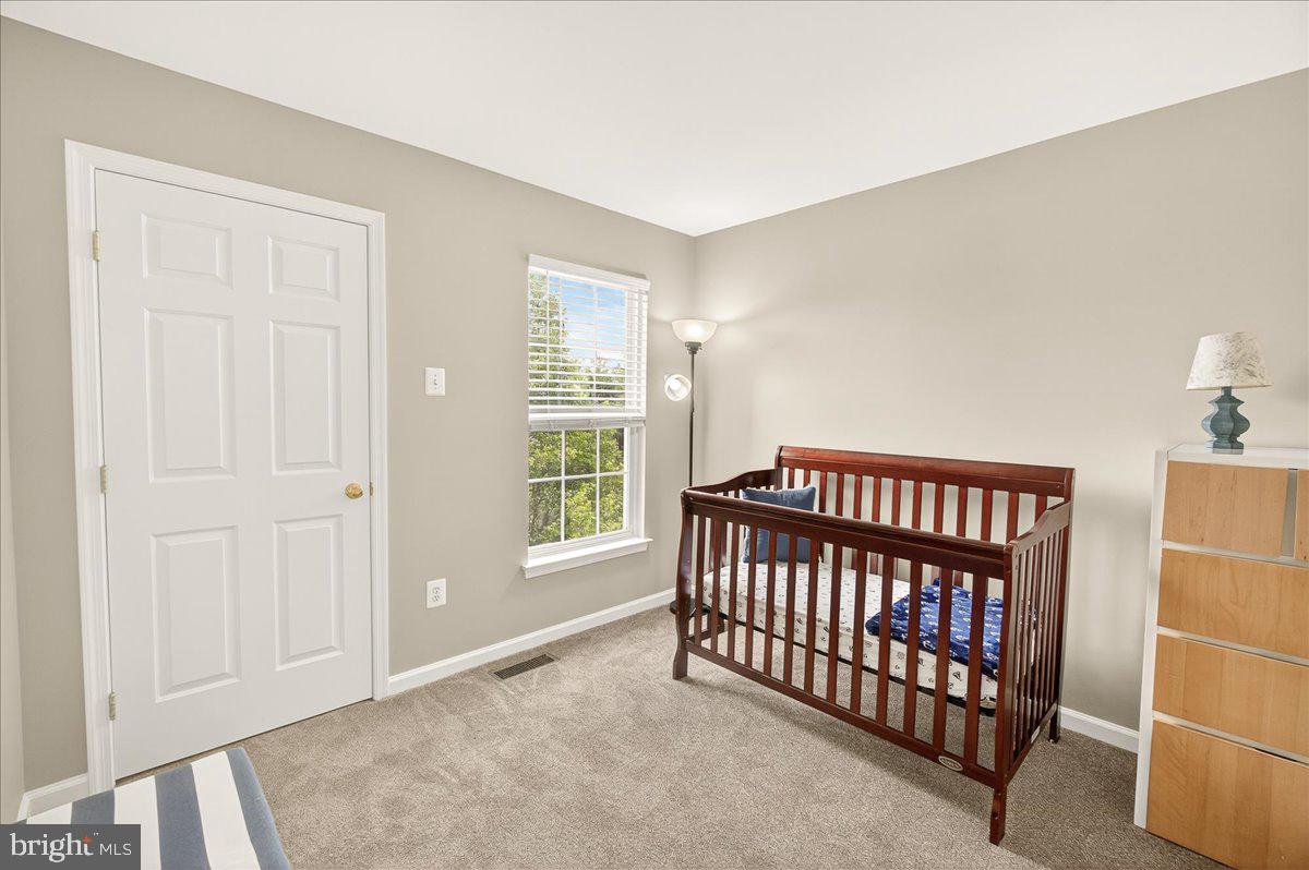 1308 Crossbow Road Mount Airy, MD 21771 - Photo 31 of 55 a view of a bedroom with furniture and staircase