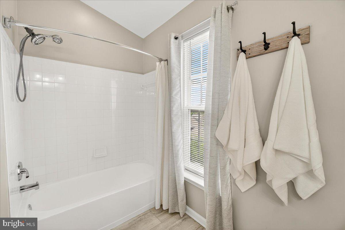 1308 Crossbow Road Mount Airy, MD 21771 - Photo 36 of 55 a bathroom with a shower and a tub