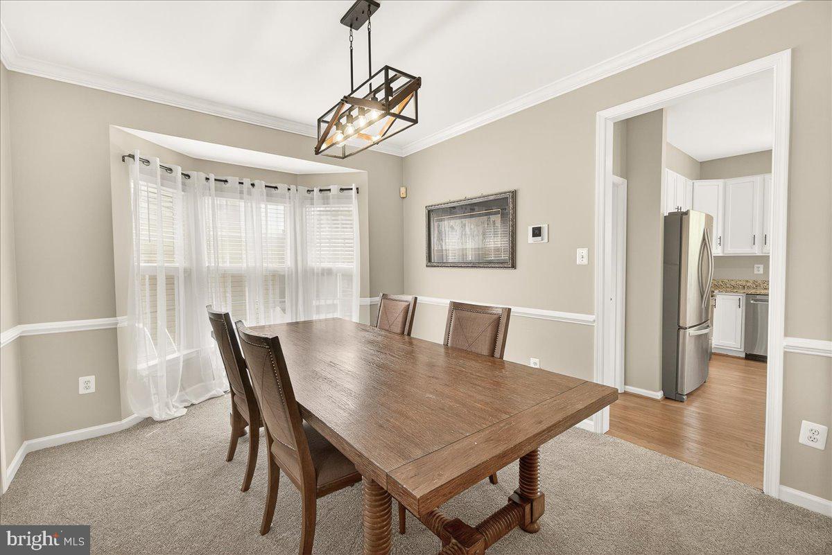1308 Crossbow Road Mount Airy, MD 21771 - Photo 9 of 55 a view of a dining room with furniture window and wooden floor