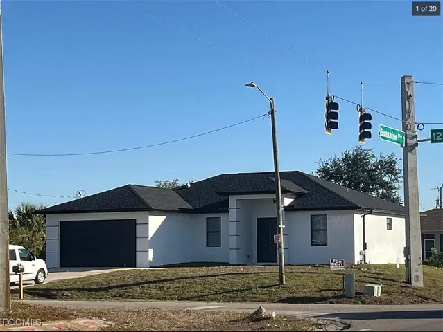 a front view of a house with a street