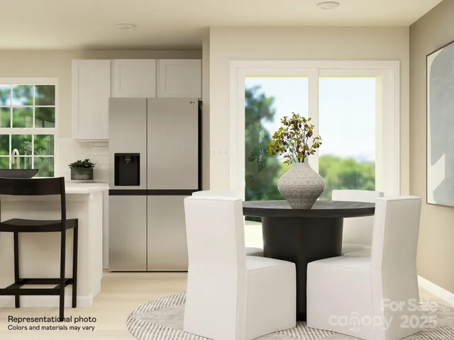 a view of a livingroom with furniture and staircase