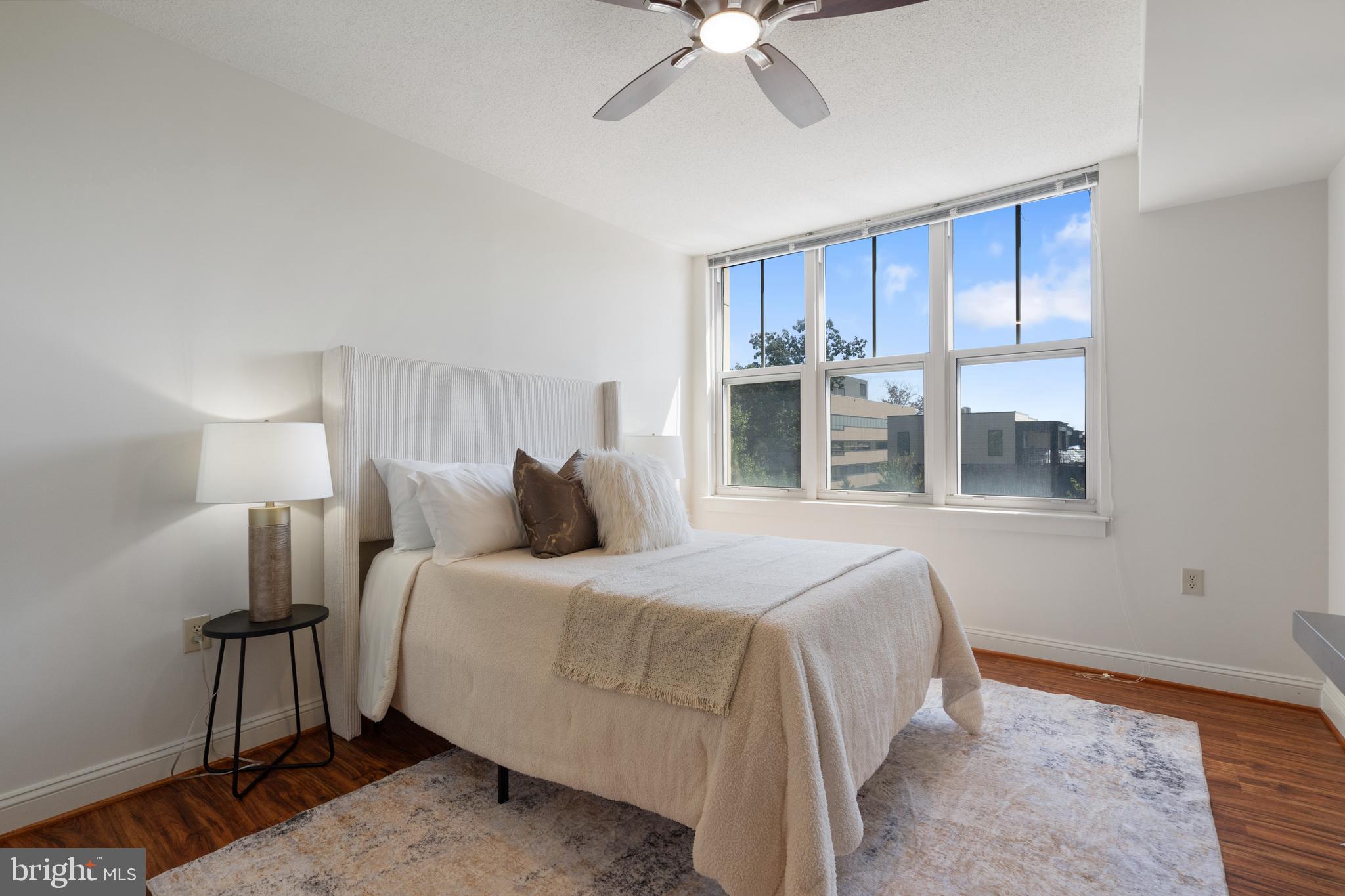 11760 Sunrise Valley Drive, Unit 209 Reston, VA 20191 - Photo 10 of 23 a bedroom with a bed and a window