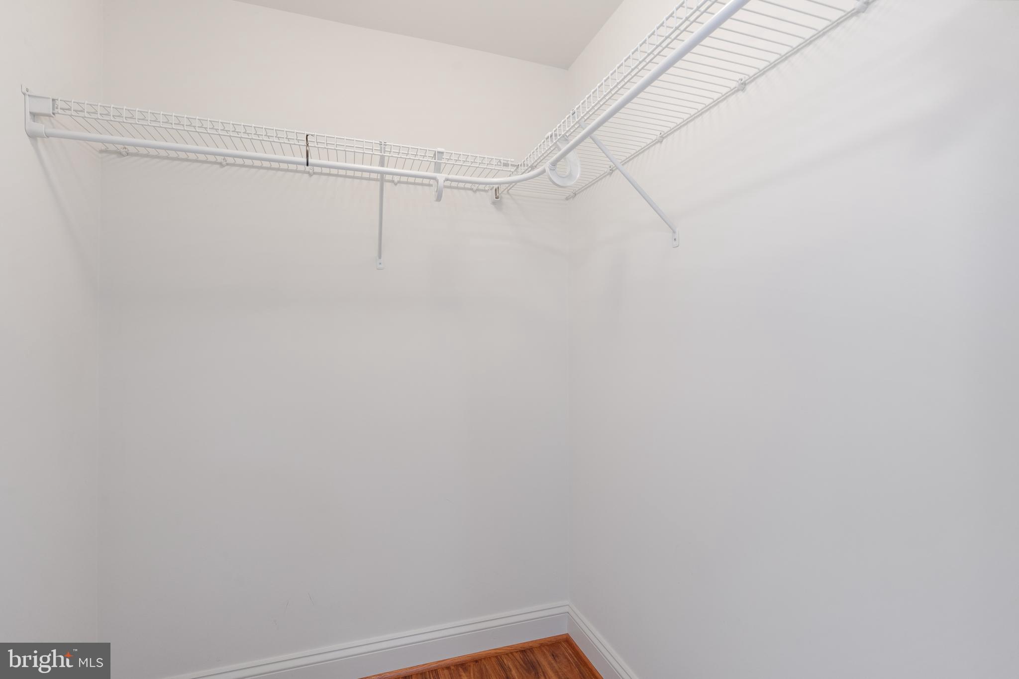 11760 Sunrise Valley Drive, Unit 209 Reston, VA 20191 - Photo 13 of 23 a view of a room with racks on the wall