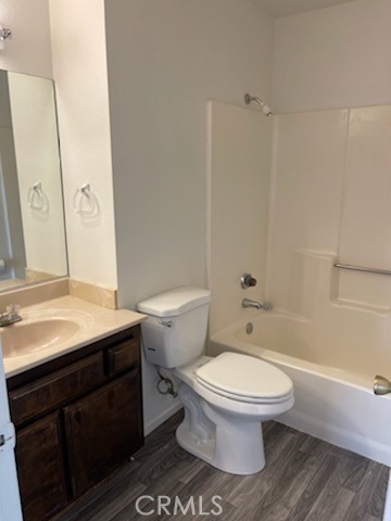 22276 Minnetonka Road Apple Valley, CA 92308 - Photo 9 of 11 a bathroom with a granite countertop toilet sink and mirror