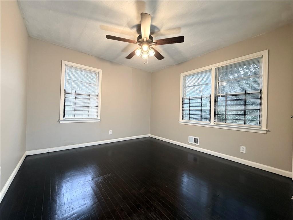 2397 Tilson Road Decatur, GA 30032 - Photo 13 of 22 a view of an empty room with wooden floor and a window