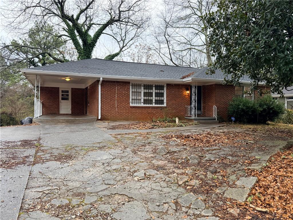 2397 Tilson Road Decatur, GA 30032 - Photo 19 of 22 a front view of a house with a yard and garage