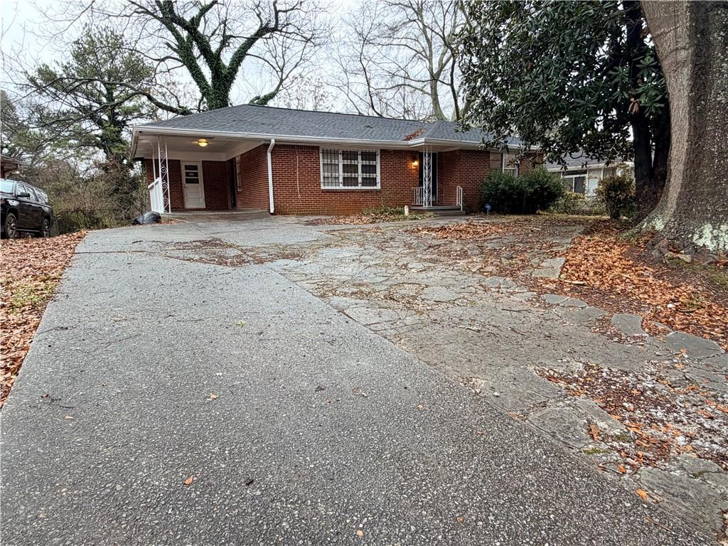 2397 Tilson Road Decatur, GA 30032 - Photo 21 of 22 a front view of house with yard and trees