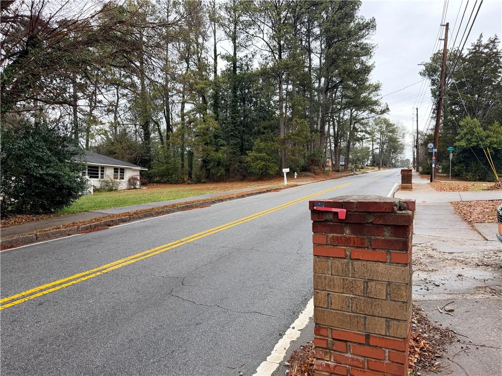 2397 Tilson Road Decatur, GA 30032 - Photo 22 of 22 a view of a terrace with a bench and trees around