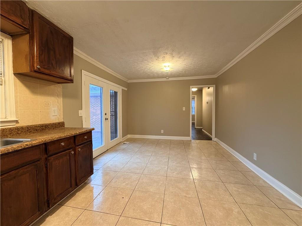 2397 Tilson Road Decatur, GA 30032 - Photo 7 of 22 a view of a kitchen with an empty space and a window