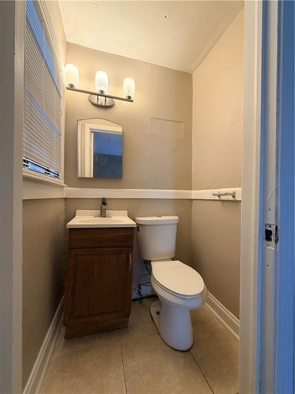 2397 Tilson Road Decatur, GA 30032 - Photo 10 of 22 a bathroom with a sink a toilet and mirror