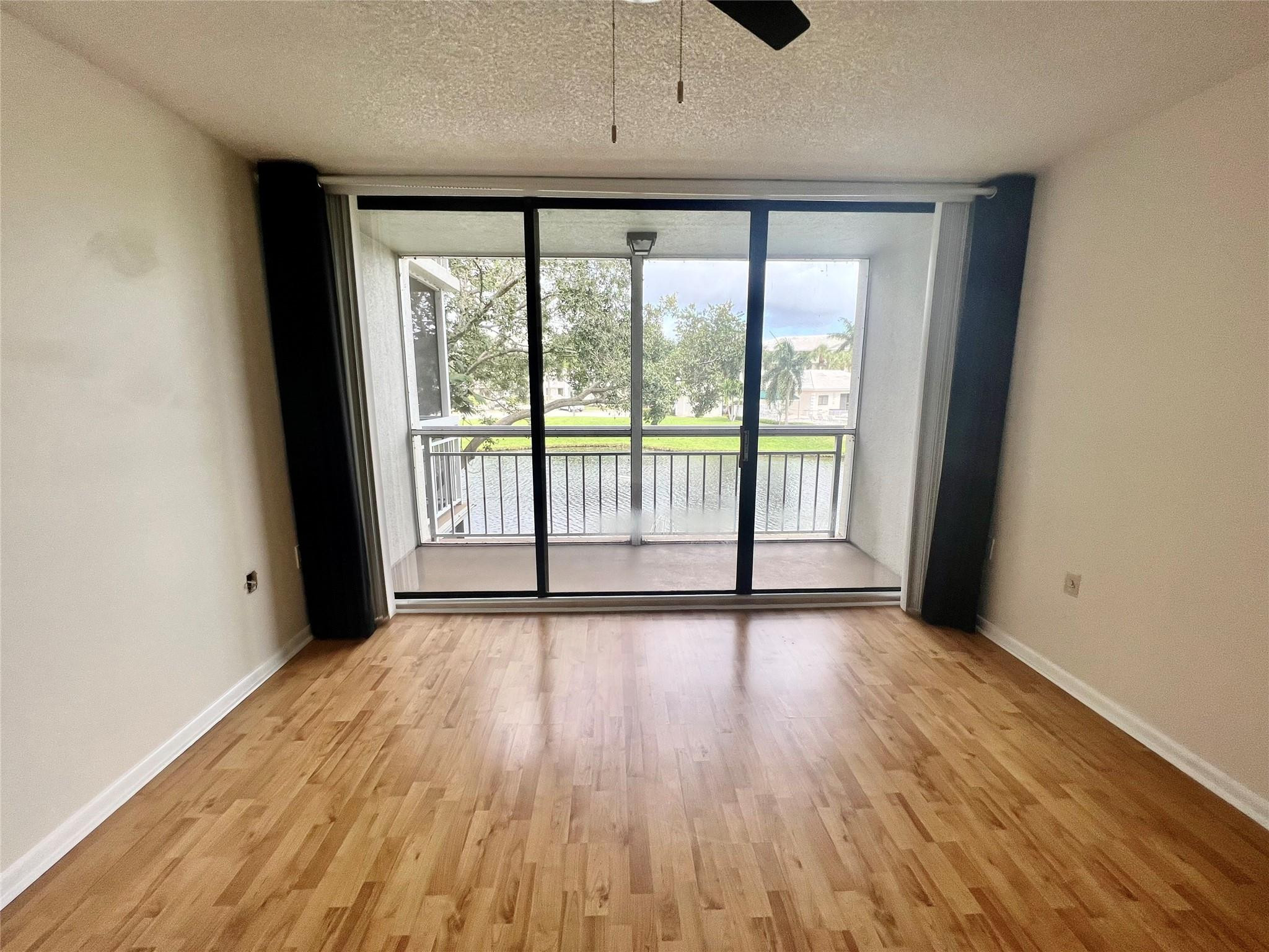 6205 Balboa Circle, Unit 202 Boca Raton, FL 33433 - Photo 18 of 40 Master Bedroom with Patio and Waterview
