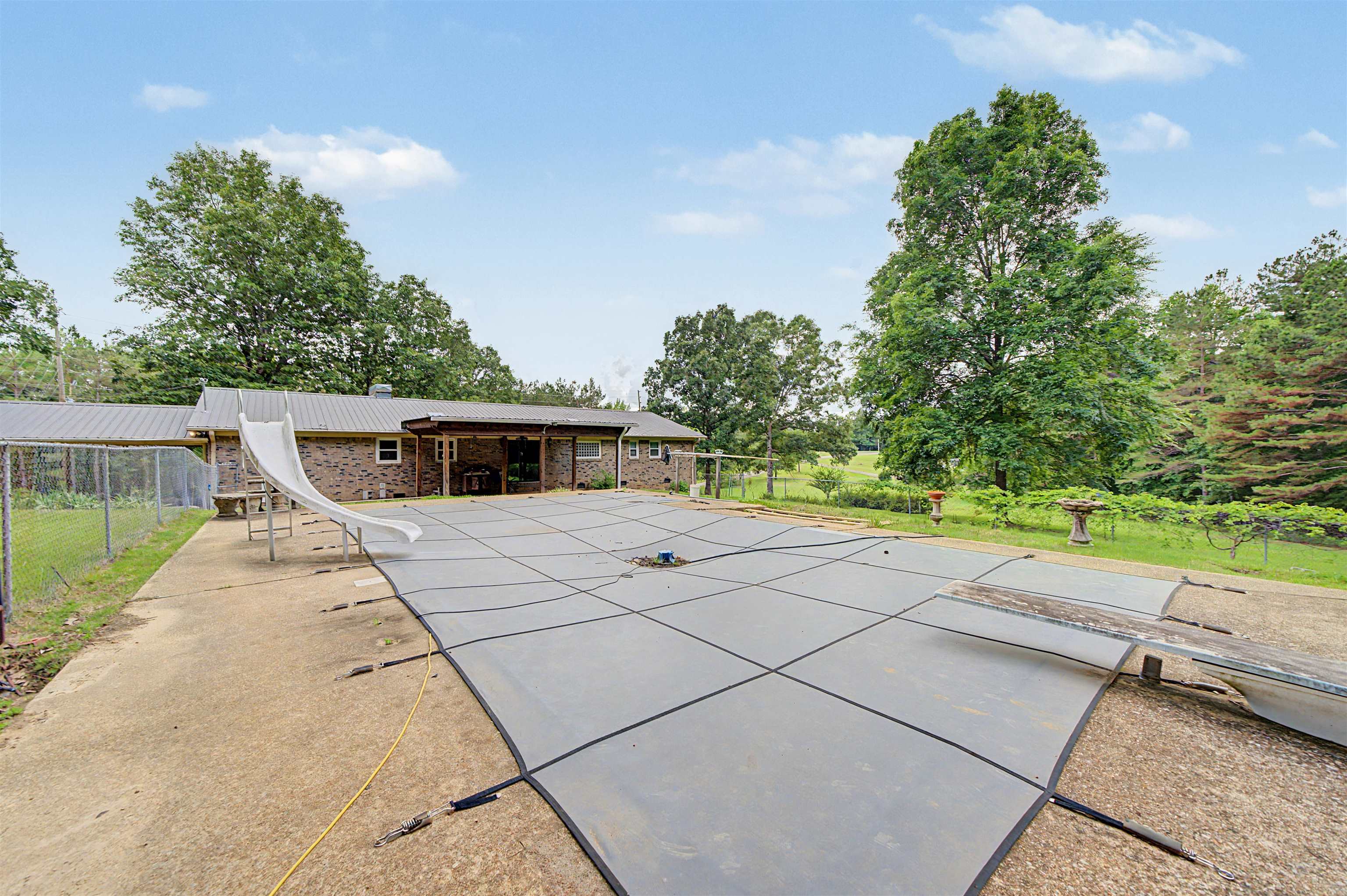 436 Skyline Road Selmer, TN 38375 - Photo 16 of 40 Expansive covered swimming pool with concrete surround