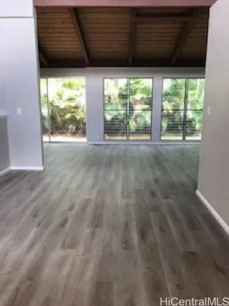 a view of a room with a large window