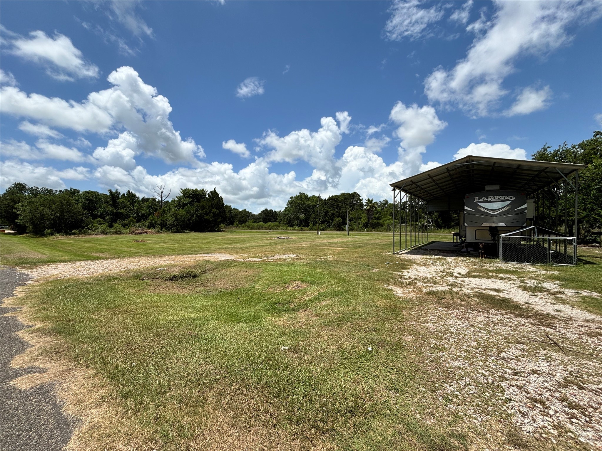 608 Neirbo Street Anahuac, TX 77514 - Photo 2 of 5 a view of a house with a yard