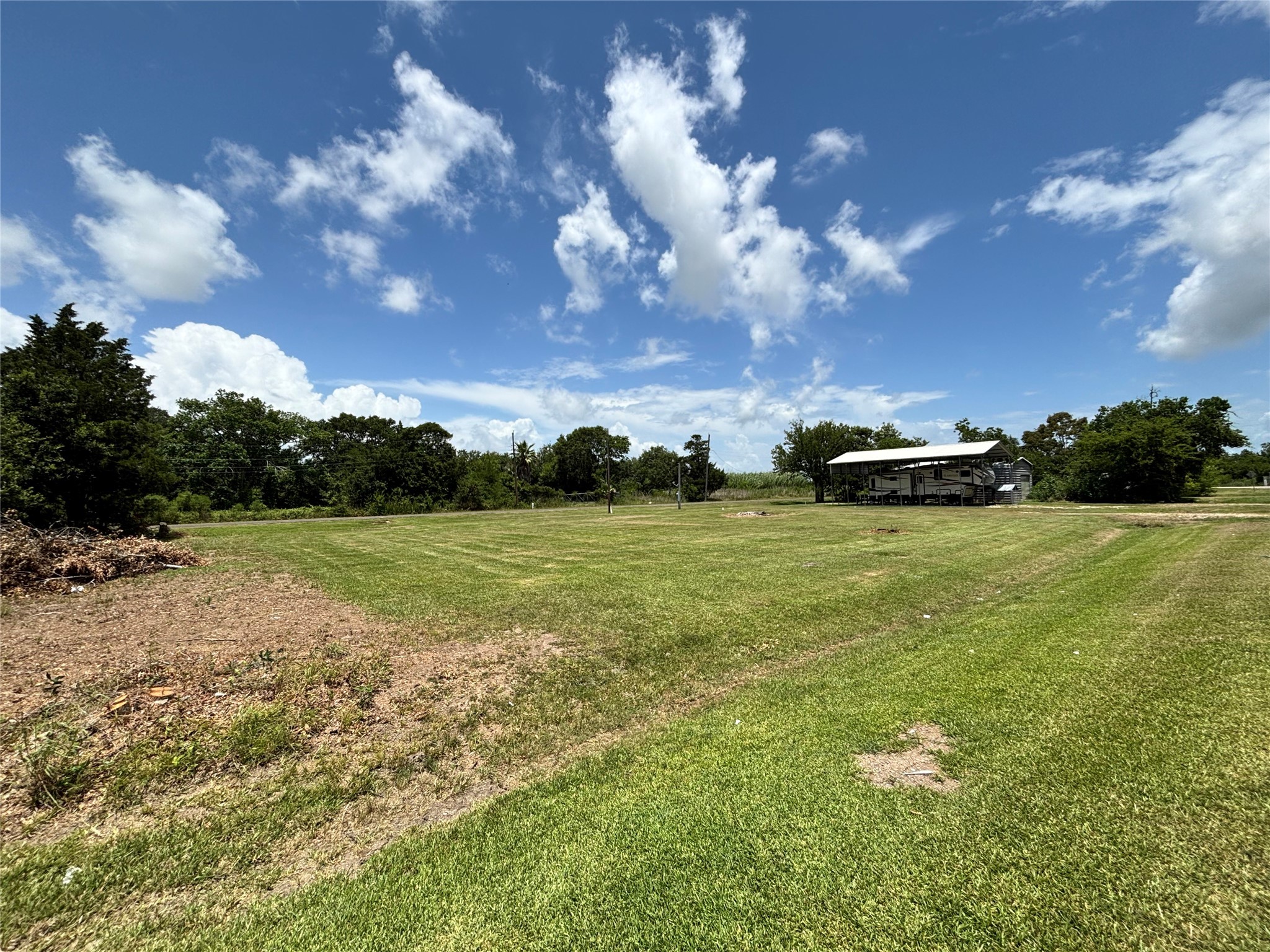 608 Neirbo Street Anahuac, TX 77514 - Photo 4 of 5 a view of yard with green space