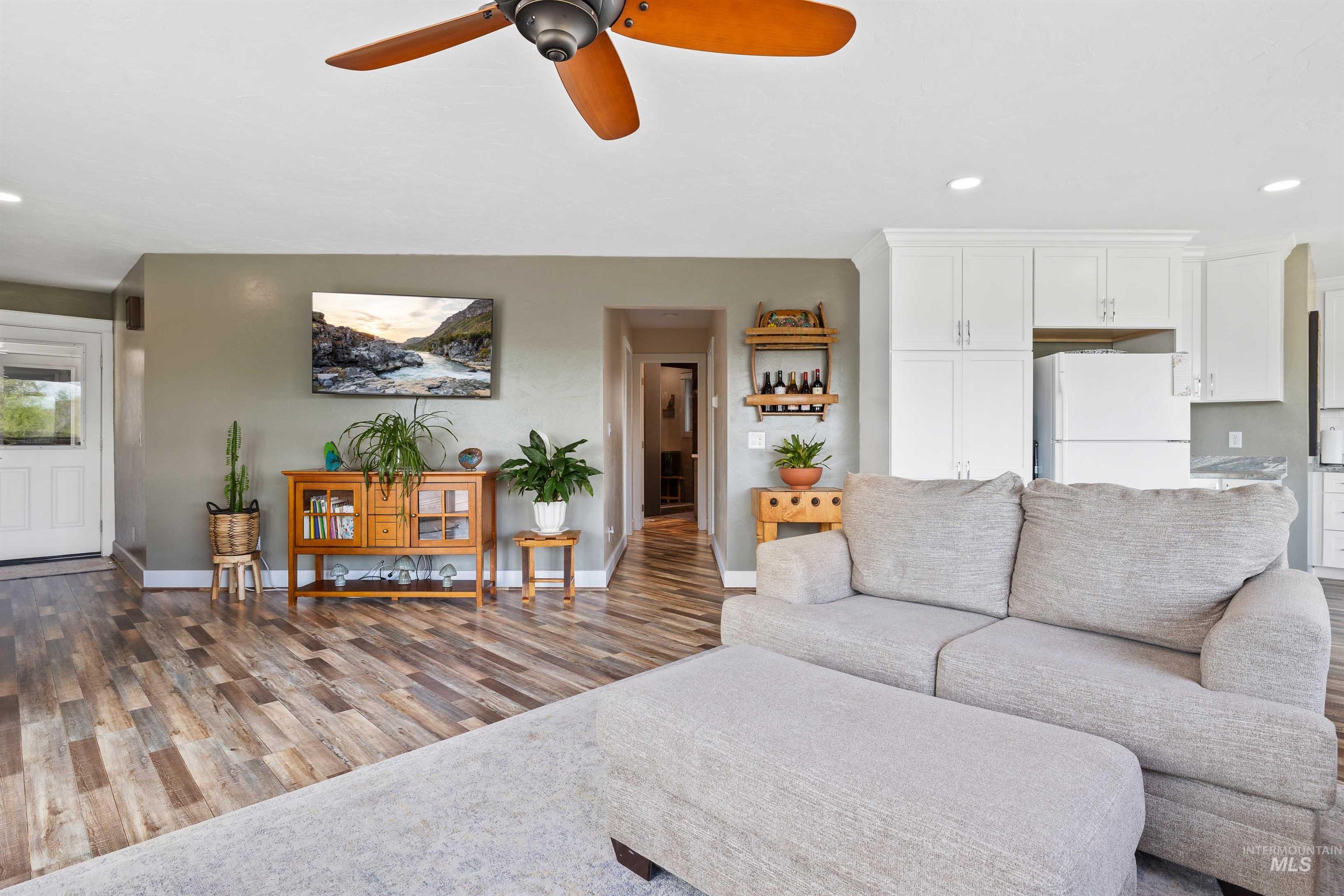 11 Bell Rapids Road Hagerman, ID 83332 - Photo 17 of 40 Open-concept living area featuring wood-finish flooring, recessed lighting, and a ceiling fan