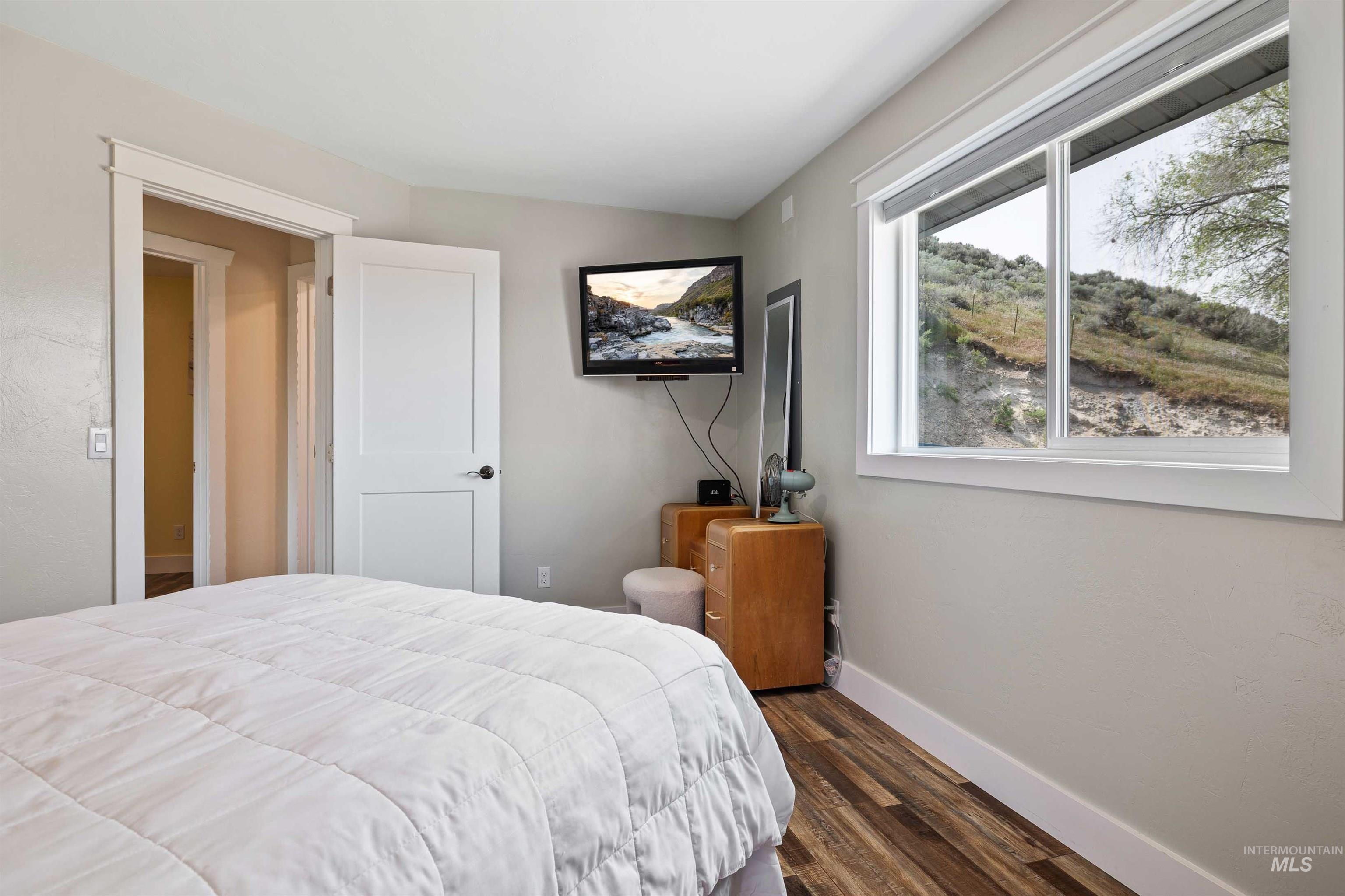 11 Bell Rapids Road Hagerman, ID 83332 - Photo 24 of 40 Room featuring wood-finish flooring, light neutral wall paint, and white trim