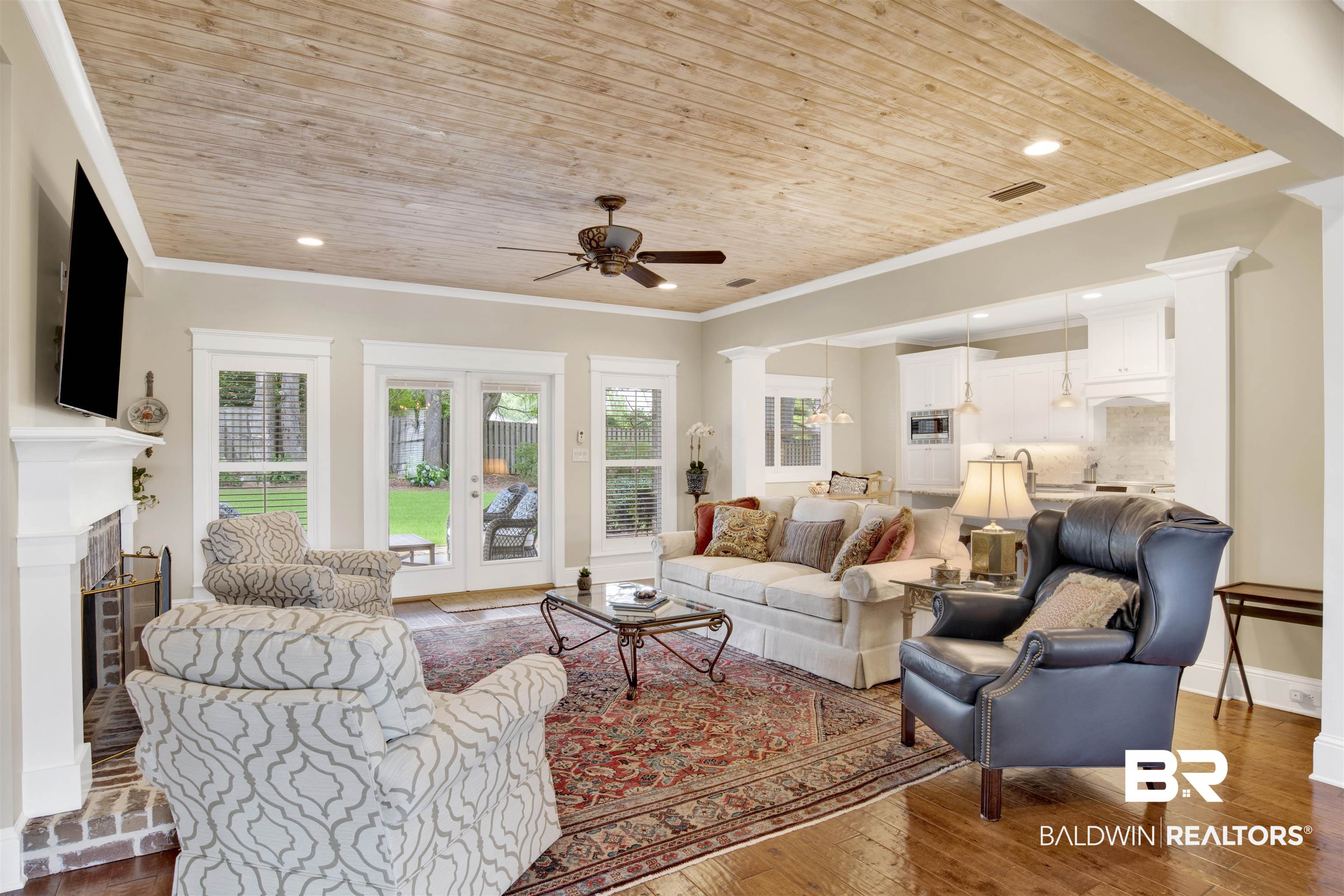 131 Sedgefield Avenue Fairhope, AL 36532 - Photo 11 of 50 Living room featuring crown molding, wooden ceiling, and wood-type flooring