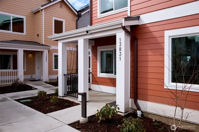 a front view of house with yard outdoor seating and barbeque oven