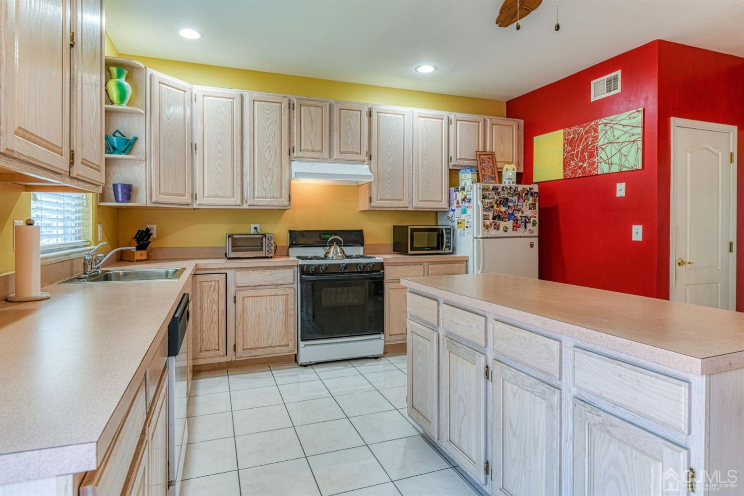 11 Timber Ridge Road North Brunswick, NJ 08902 - Photo 14 of 27 a kitchen with granite countertop a stove top oven sink and cabinets