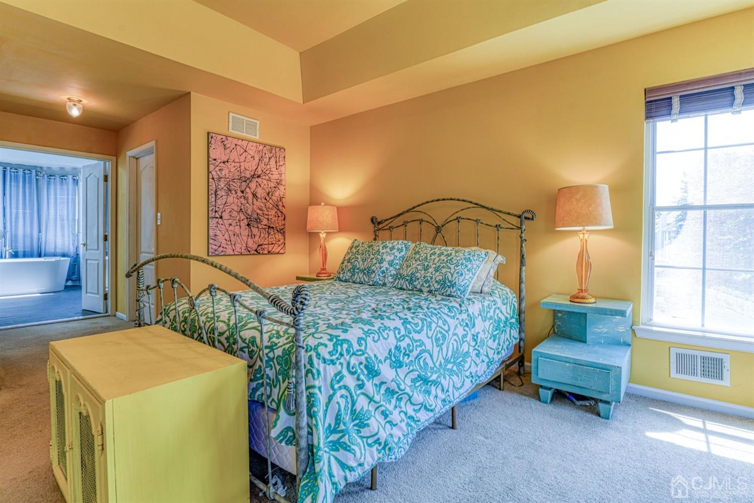 11 Timber Ridge Road North Brunswick, NJ 08902 - Photo 22 of 27 a bedroom with a bed and a table in it