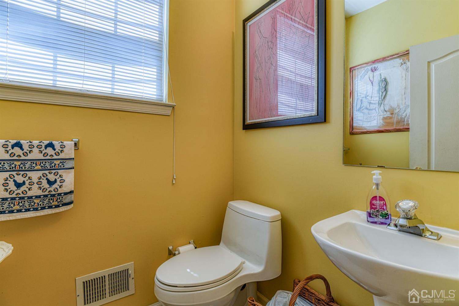11 Timber Ridge Road North Brunswick, NJ 08902 - Photo 8 of 27 a bathroom with a toilet a sink and a window