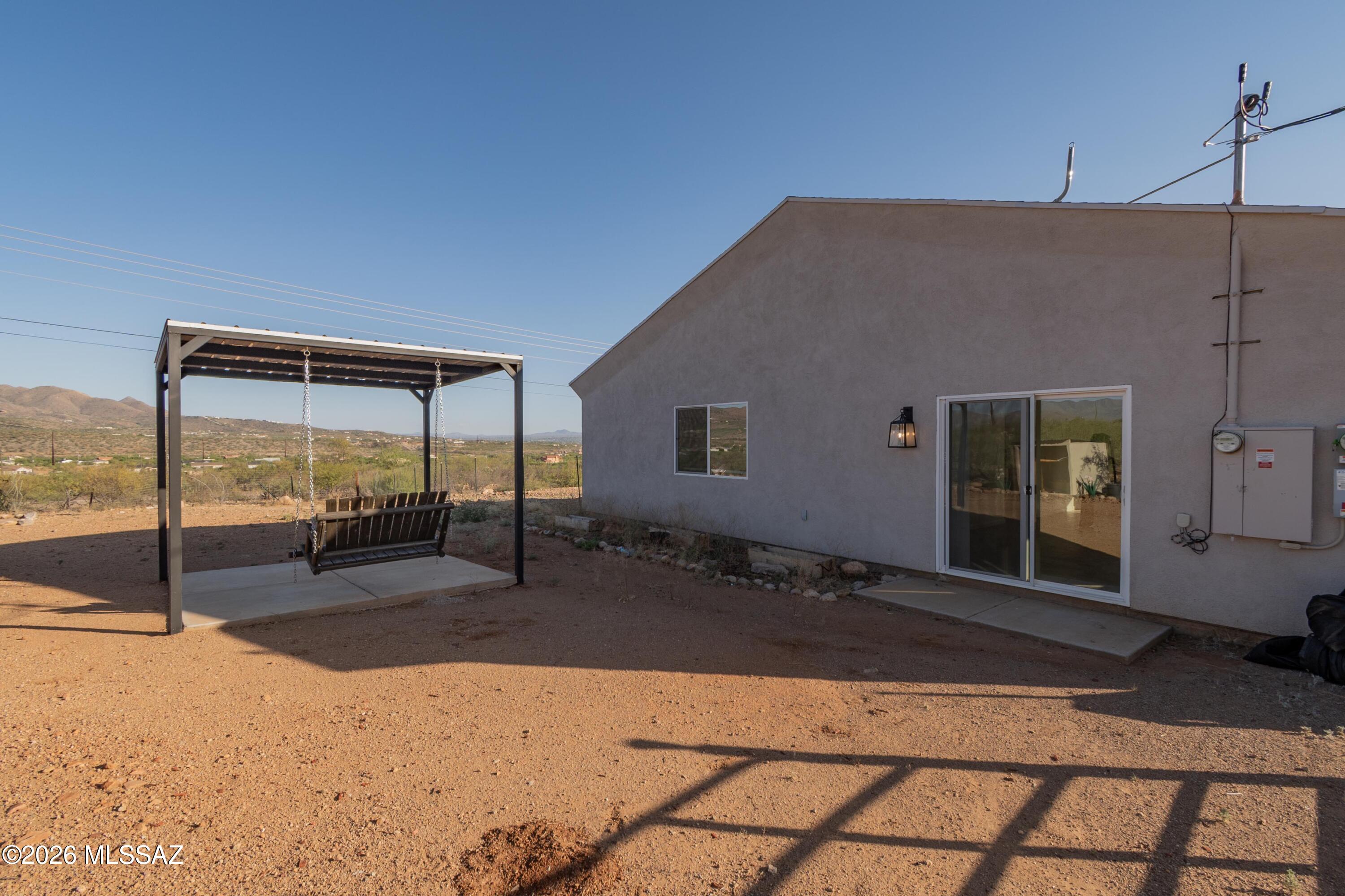 1785 Dove Court Rio Rico, AZ 85648 - Photo 25 of 31 a backyard of a house with seating space