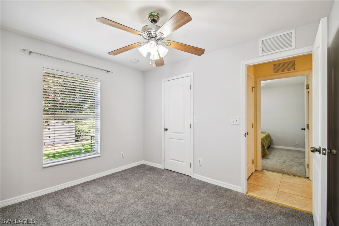 430 Rathburn Street Lehigh Acres, FL 33974 - Photo 19 of 50 a view of an empty room with a window