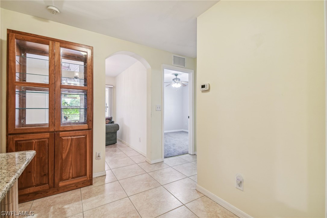 430 Rathburn Street Lehigh Acres, FL 33974 - Photo 25 of 50 a bathroom with a glass door shower and a sink