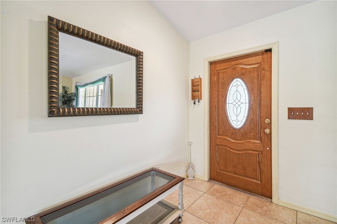 430 Rathburn Street Lehigh Acres, FL 33974 - Photo 3 of 50 a view of a hallway with wooden floor