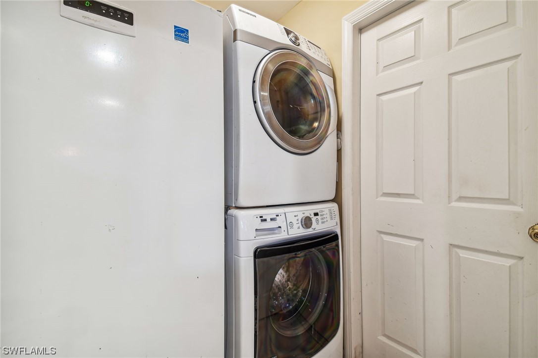 430 Rathburn Street Lehigh Acres, FL 33974 - Photo 33 of 50 a utility room with dryer and washer