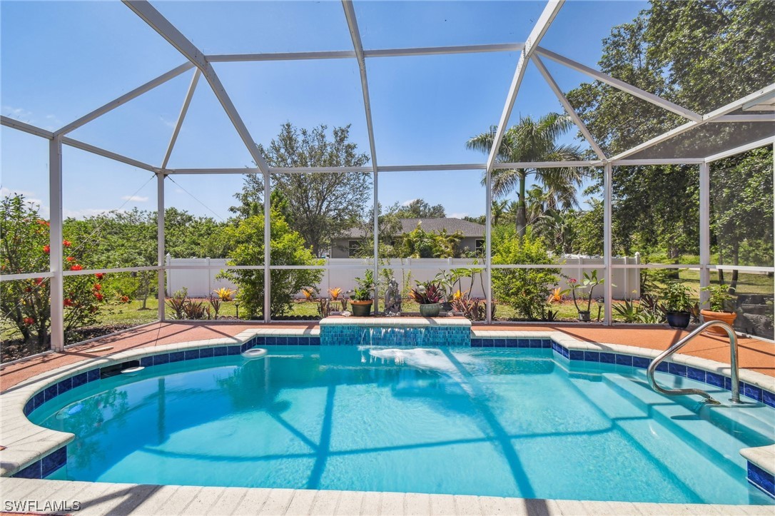 430 Rathburn Street Lehigh Acres, FL 33974 - Photo 36 of 50 a view of a backyard with sitting area