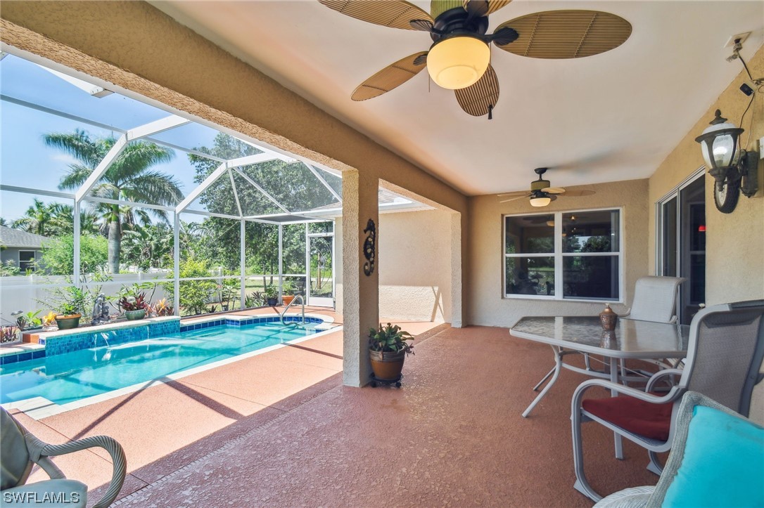 430 Rathburn Street Lehigh Acres, FL 33974 - Photo 41 of 50 a view of a porch with furniture and a backyard