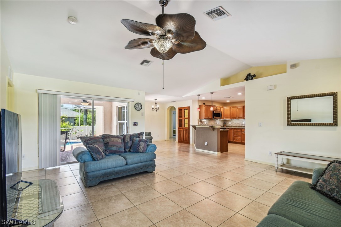 430 Rathburn Street Lehigh Acres, FL 33974 - Photo 5 of 50 a living room with furniture and flat screen tv