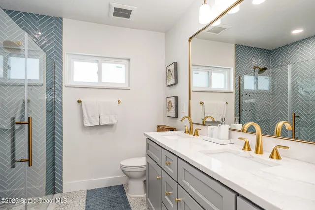a hallway with stairs and wooden floor