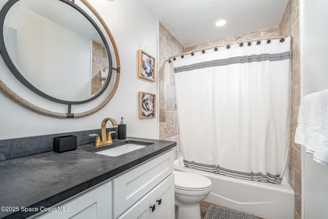 a bedroom with two beds and a window