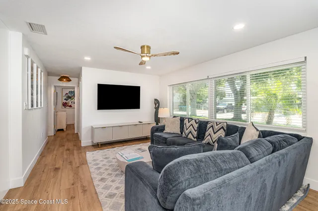an aerial view of residential building and ocean