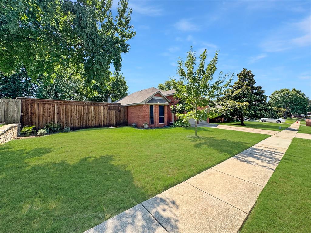 806 Glenwood Court McKinney, TX 75071 - Photo 22 of 29 a view of a backyard with a garden