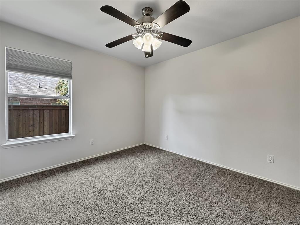 806 Glenwood Court McKinney, TX 75071 - Photo 26 of 29 a view of an empty room with a window