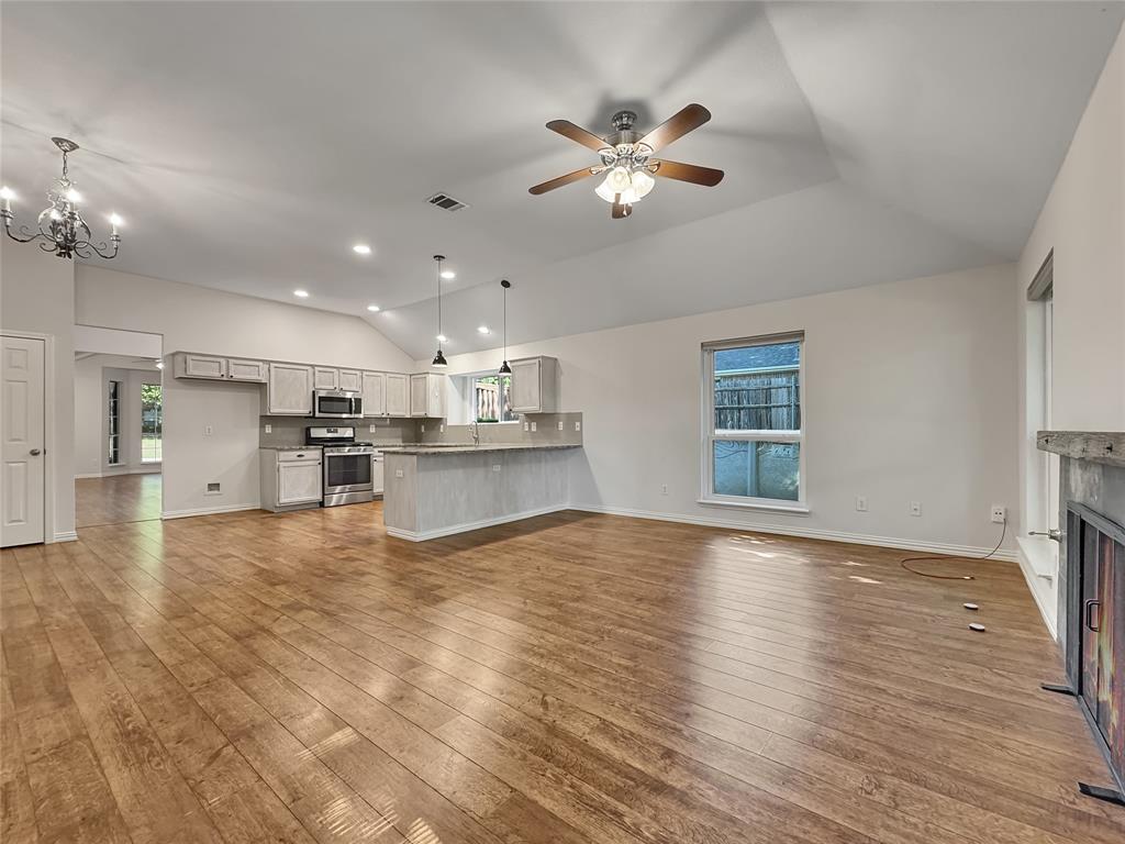 806 Glenwood Court McKinney, TX 75071 - Photo 3 of 29 a view of a kitchen with a sink and chandelier