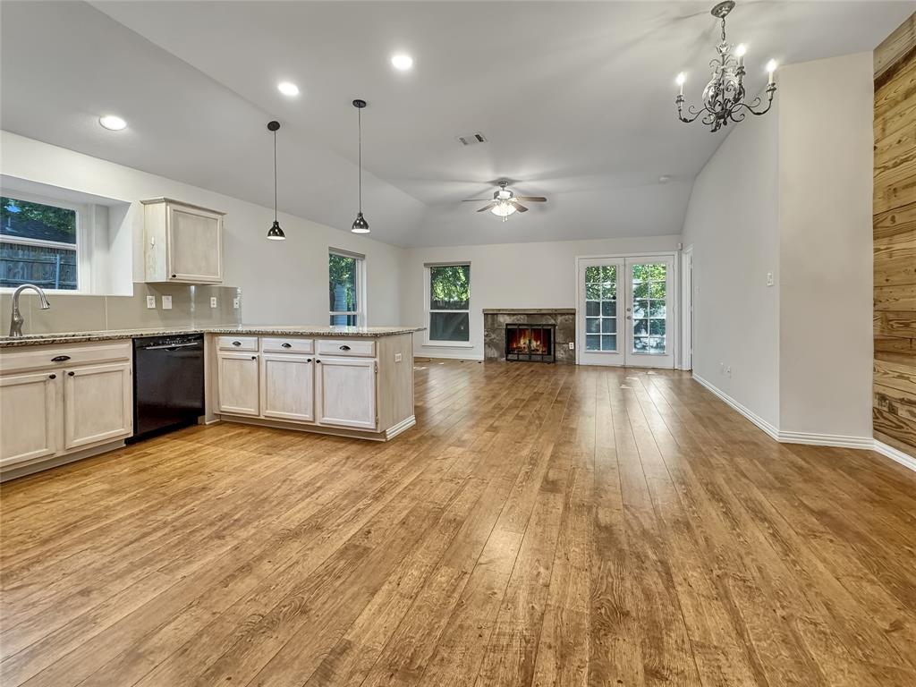 806 Glenwood Court McKinney, TX 75071 - Photo 8 of 29 a large kitchen with cabinets wooden floor and stainless steel appliances